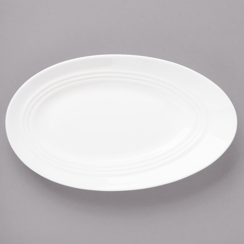 Bon Chef 1100007P Slanted Oval 9 1/2" x 5 5/8" White Porcelain Plate - 24/Case
