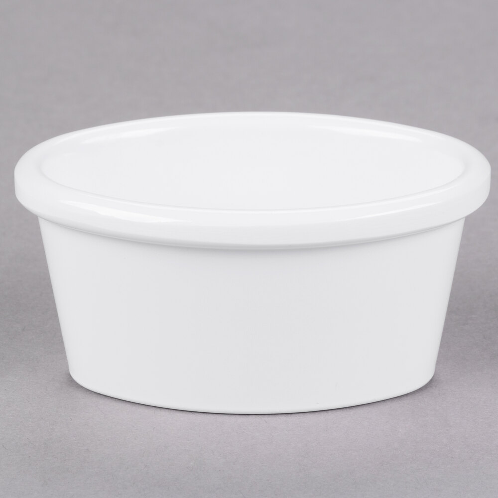 Carlisle S31002 2 oz. Smooth White Oval Melamine Ramekin - 48/Case
